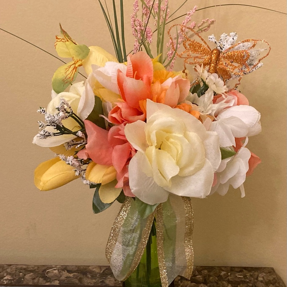 Beautiful Vase of Spring Flowers with A Butterfly Accent.